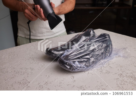 vacuum packing sneakers. for seasonal storage close-up. 106961553