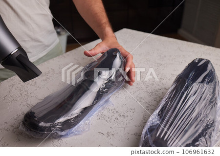 vacuum packing sneakers. for seasonal storage close-up. 106961632