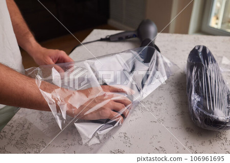 vacuum packing sneakers. for seasonal storage close-up. vacuum packing sneakers. for seasonal storage close-up. 106961695