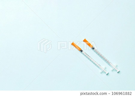 Top view of insulin syringes ready for injection on colorful background. Diabetic concept with copy space 106961882