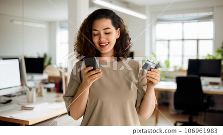 Woman is doing online purchases Woman is doing online purchases 106961983