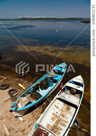 Fishing boats waiting by Ulubat or Uluabat Lake in Bursa, Turkey, June 25 2023 Fishing boats waiting by Ulubat or Uluabat Lake in Bursa, Turkey, June 25 2023 106962235