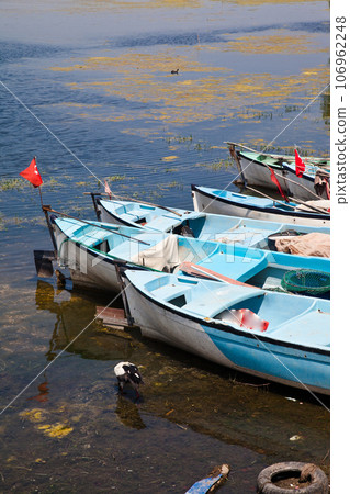 Fishing boats waiting by Ulubat or Uluabat Lake in Bursa, Turkey, June 25 2023 Fishing boats waiting by Ulubat or Uluabat Lake in Bursa, Turkey, June 25 2023 106962248