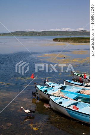 Fishing boats waiting by Ulubat or Uluabat Lake in Bursa, Turkey, June 25 2023 Fishing boats waiting by Ulubat or Uluabat Lake in Bursa, Turkey, June 25 2023 106962249