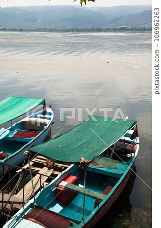 Fishing boats waiting by Ulubat or Uluabat Lake in Bursa, Turkey, June 25 2023 Fishing boats waiting by Ulubat or Uluabat Lake in Bursa, Turkey, June 25 2023 106962263