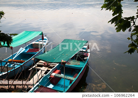 Fishing boats waiting by Ulubat or Uluabat Lake in Bursa, Turkey, June 25 2023 Fishing boats waiting by Ulubat or Uluabat Lake in Bursa, Turkey, June 25 2023 106962264