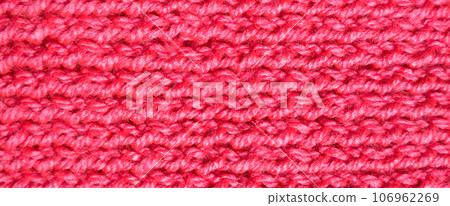 Handmade knitted fabric pink and red wool background texture Handmade knitted fabric pink and red wool background texture 106962269