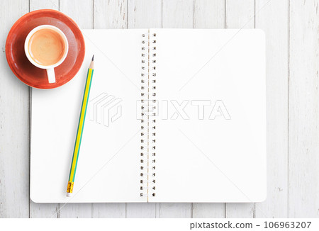 Top view of blank paper,pencil and cup of coffee on white wooden table Top view of blank paper,pencil and cup of coffee on white wooden table 106963207