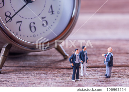 Businessman figures standing on the floor and business negotiations Businessman figures standing on the floor and business negotiations 106963234