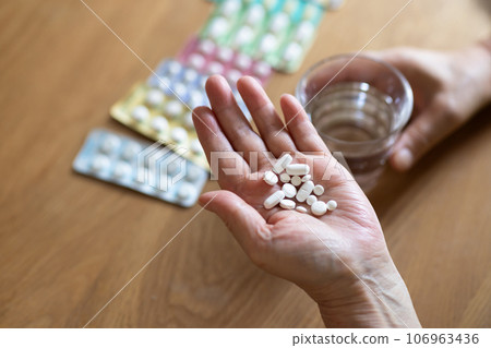 Elderly people taking medicine 106963436