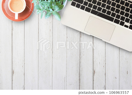 Flat lay home business desk with communication device 106963557