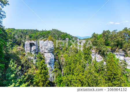 Panoramic view of a sandstone rock city in Bohemian Paradise, Czech: Cesky raj. Slunecna Rock in Hruba skala rock city town. Czech Republic 106964132