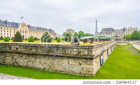 Historical cannons at Les Invalides and parisian cityscape with Eiffel Tower, Paris, France Historical cannons at Les Invalides and parisian cityscape with Eiffel Tower, Paris, France 106964137