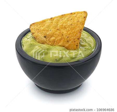 Guacamole and nachos isolated on white background, full depth of field 106964686