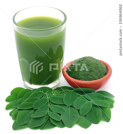 Moringa leaves with extract in a glass Moringa leaves with extract in a glass 106964868