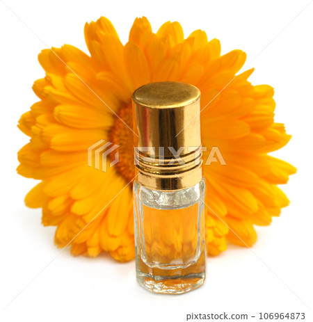 Closeup of calendula with essence bottle Closeup of calendula with essence bottle 106964873