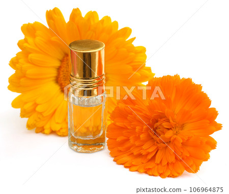 Closeup of calendula with essence bottle Closeup of calendula with essence bottle 106964875