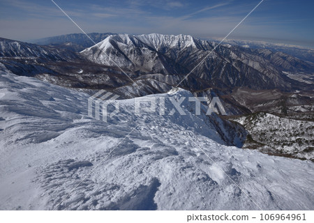 Looking towards Mt. Mt. Asahidake and Mt. Mikura from near the summit of Mt. Koshi Asahidake 106964961