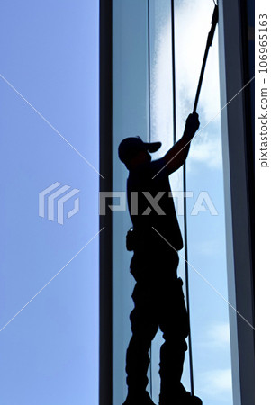 silhouette of worker cleaning exterior windows of skyscrapers silhouette of worker cleaning exterior windows of skyscrapers 106965163