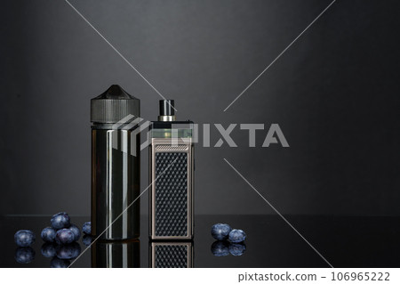 Vape smoking liquid with berry flavor close up Vape smoking liquid with berry flavor close up 106965222