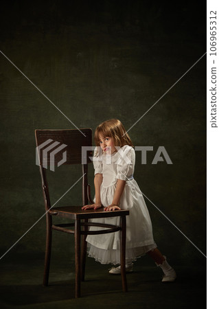 Portrait of charming, grimacing girl, like character of fairytail in historical clothes over vintage background. Favourite story tale. Portrait of charming, grimacing girl, like character of fairytail in historical clothes over vintage background. Favourite story tale. 106965312