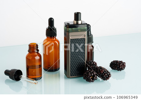 Vape smoking liquid with berry flavor close up Vape smoking liquid with berry flavor close up 106965349