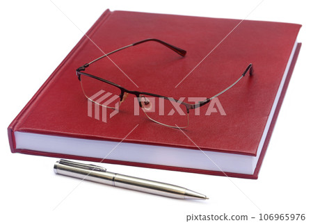 Maroon colored thesis paper with spectacles 106965976