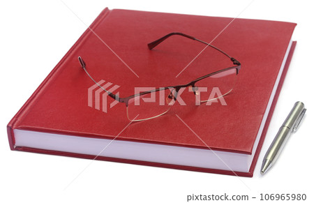 Maroon colored thesis paper with spectacles 106965980