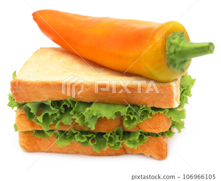 Bread slices with banana pepper and green lettuce inside Bread slices with banana pepper and green lettuce inside 106966105