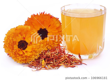 Herbal calendula flower with extract in a glass 106966181