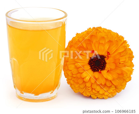 Herbal calendula flower with extract in a glass Herbal calendula flower with extract in a glass 106966185