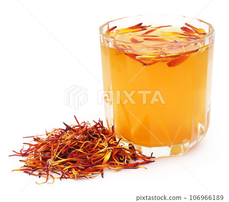 Herbal calendula flower with extract in a glass Herbal calendula flower with extract in a glass 106966189