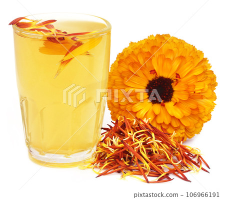 Herbal calendula flower with extract in a glass Herbal calendula flower with extract in a glass 106966191