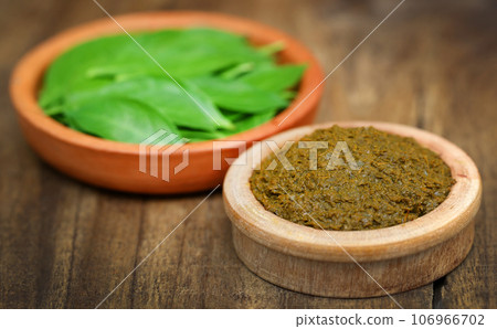Ayurvedic henna leaves with paste 106966702