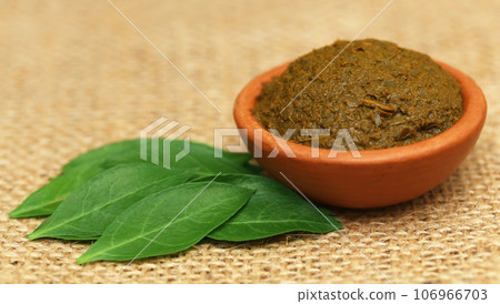 Ayurvedic henna leaves with paste 106966703