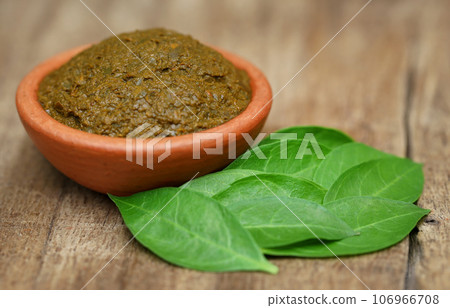 Ayurvedic henna leaves with paste 106966708