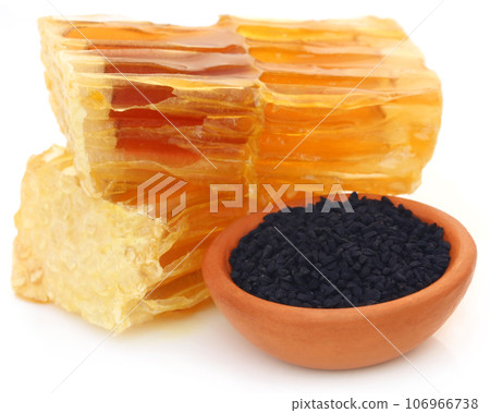 Honey with black cumin in a pottery 106966738