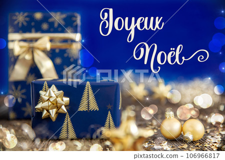 Text Joyeux Noel, Means Merry Christmas, Golden And Blue Christmas Decoration 106966817