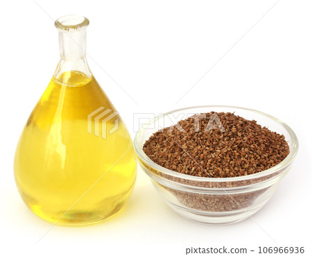 Ajwain seeds in a glass bowl with essential oil 106966936