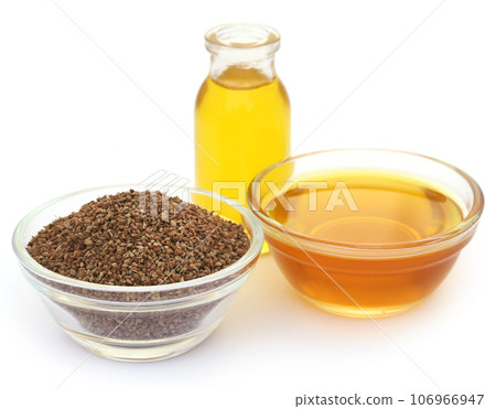 Ajwain seeds in a glass bowl with essential oil 106966947