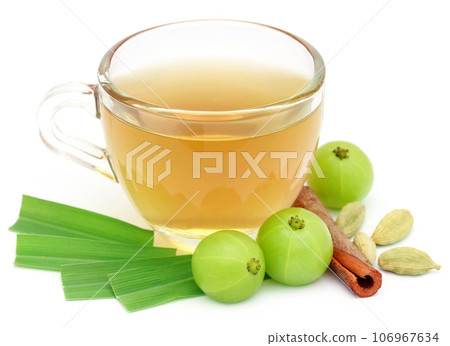 Herbal tea in a cup with different herbs Herbal tea in a cup with different herbs 106967634
