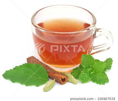 Herbal tea in a cup with different herbs Herbal tea in a cup with different herbs 106967638