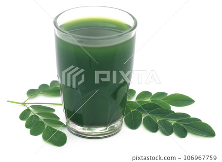 Moringa leaves with extract in a glass Moringa leaves with extract in a glass 106967759
