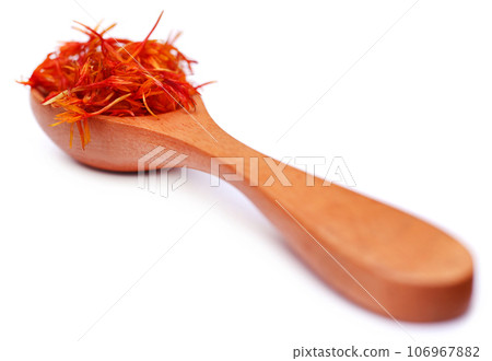Safflower in a wooden spoon Safflower in a wooden spoon 106967882