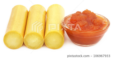 Piece of sugarcane with molasses 106967933