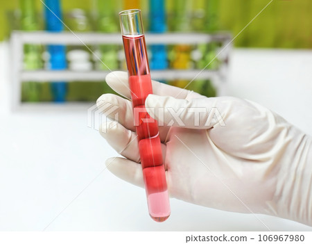 Hand holding a test tube Hand holding a test tube 106967980
