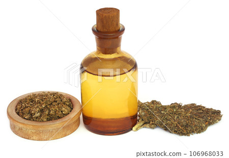 Medicinal cannabis with extract oil in a bottle 106968033