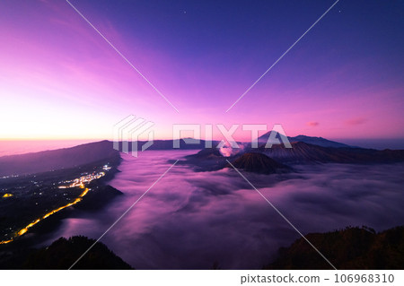 Amazing Mount Bromo volcano during sunrise from king kong viewpoint on Mountain Penanjakan in Bromo Tengger Semeru National Park,East Java,Indonesia.Nature landscape background Amazing Mount Bromo volcano during sunrise from king kong viewpoint on Mountain Penanjakan in Bromo Tengger Semeru National Park,East Java,Indonesia.Nature landscape background 106968310