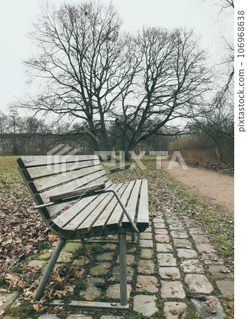 Lonely old wooden bench outdoor 106968638