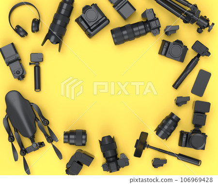 Top view of monochrome designer workspace and photography gear on yellow 106969428